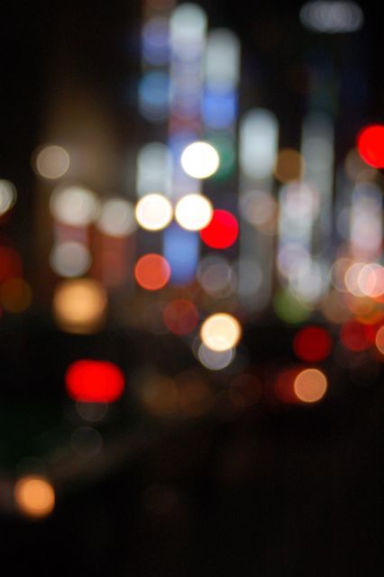 Abstract city lights at night, representing the energy and focus of building in-house legal teams